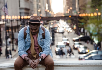 man sitting on wall