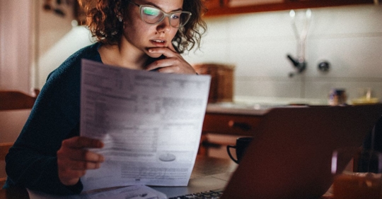 woman inspecting finances
