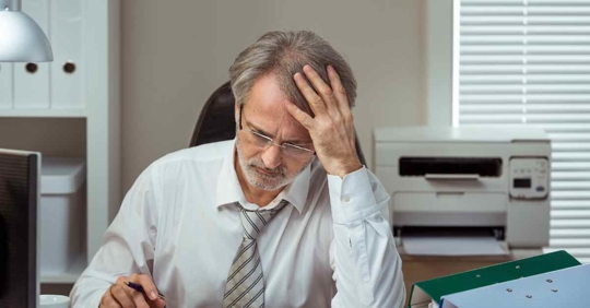 A frustrated man looking at his finances