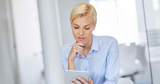 A woman reviewing something on her iPad