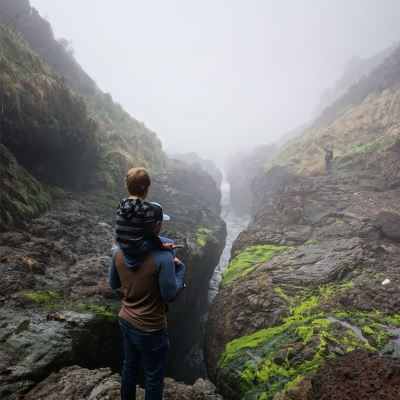 father with child hiking