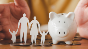 Family figures standing on coins next to a piggy bank, symbolizing estate planning and financial protection.