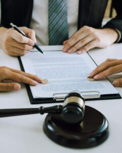 Lawyer signing a document